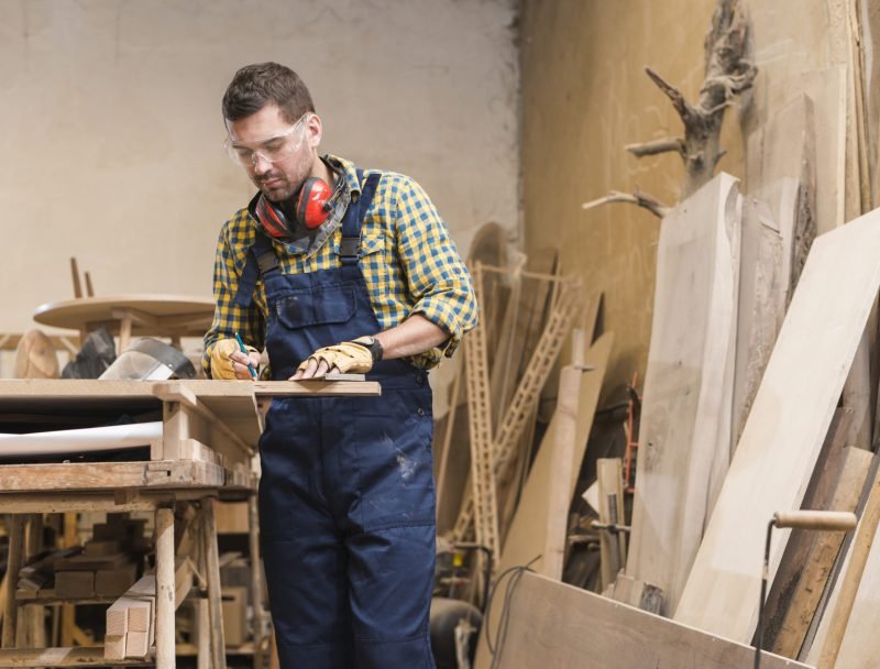 male-carpenter-working-workshop