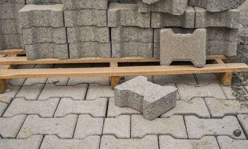 paving-slabs-stacked-pallet-road-repair-process-closeup-selective-focus-tiles-seasonal-reconstruction-pavement-walking-paths-parks_166373-3647